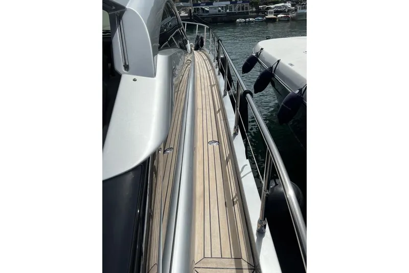  Yacht Photos Pics Side view of 2010 Pershing 56 yacht docked at marina.