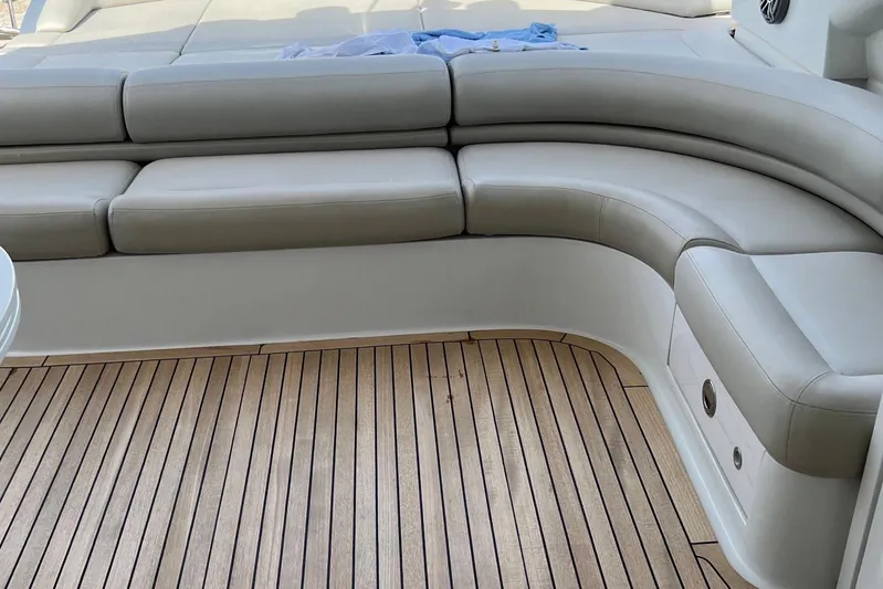  Yacht Photos Pics Luxurious seating on 2010 Pershing 56 yacht with teak deck.