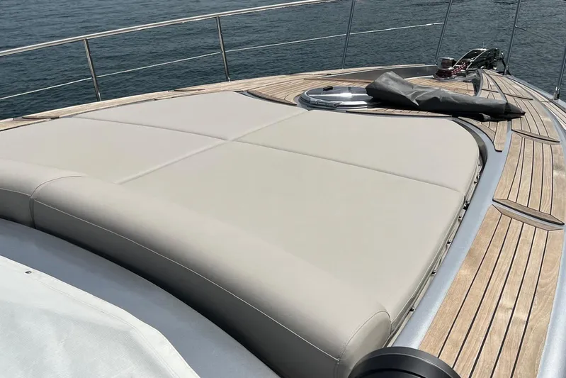  Yacht Photos Pics Luxurious 2010 Pershing 56 yacht deck with cushioned sunbathing area.