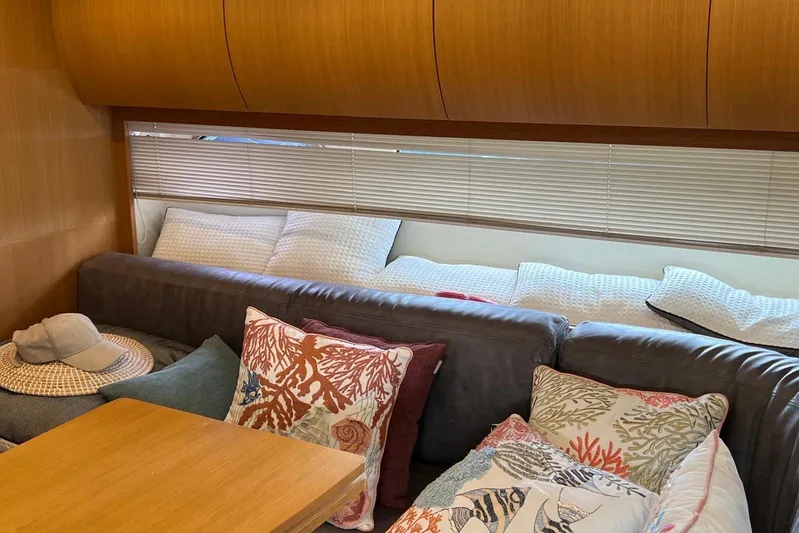  Yacht Photos Pics Luxurious interior of 2010 Pershing 56 yacht with cozy seating and decorative pillows.