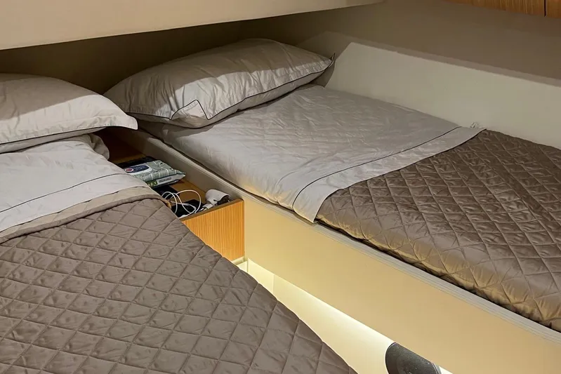  Yacht Photos Pics Twin beds in a 2010 Pershing 56 yacht cabin with quilted bedding.