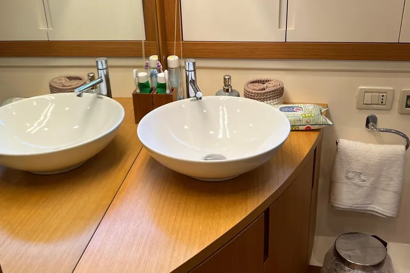  Yacht Photos Pics Luxurious bathroom on a 2010 Pershing 56 yacht with modern sink and amenities.