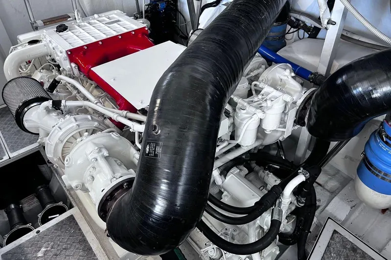  Yacht Photos Pics Engine room of a 2010 Pershing 56 yacht, showcasing complex machinery and components.