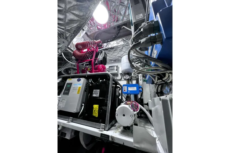  Yacht Photos Pics Engine room of a 2010 Pershing 56 yacht with complex machinery and wiring.