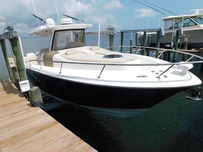 Happily Ever After Yacht Photos Pics 2016 Belzona 327 WA boat docked, featuring sleek design and spacious deck.