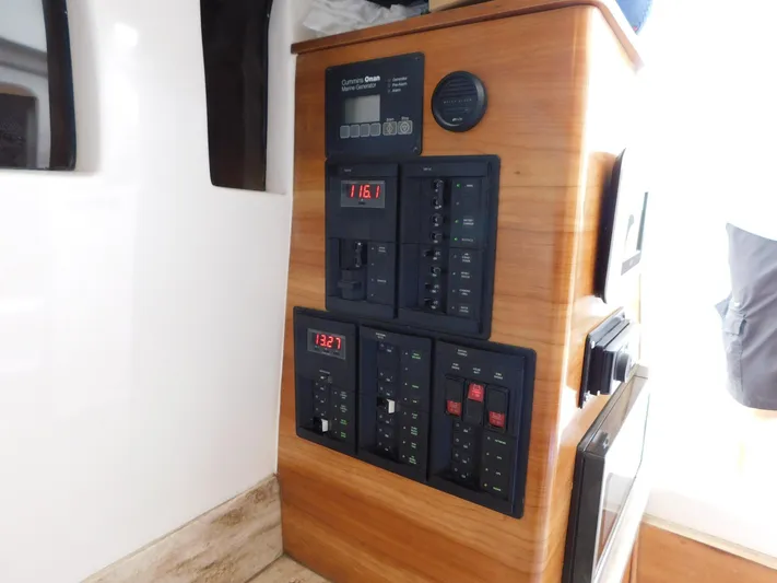 Happily Ever After Yacht Photos Pics Control panel inside 2016 Belzona 327 WA boat, featuring digital displays and switches.