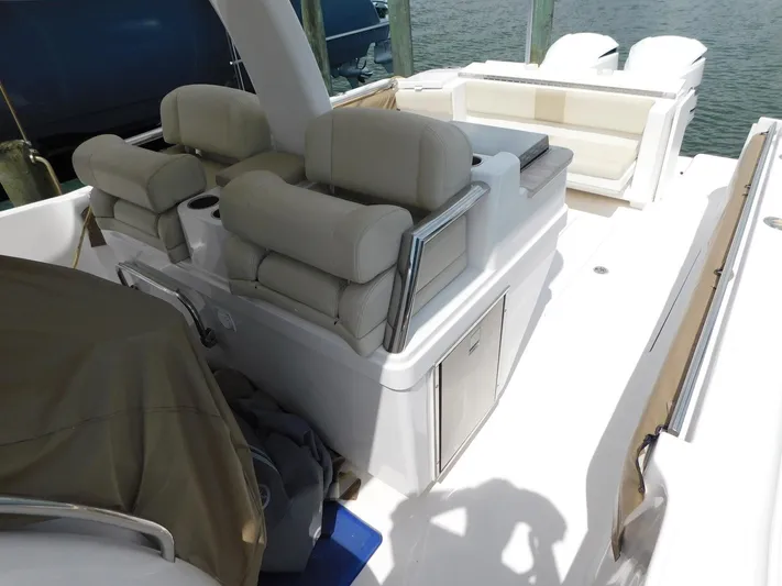 Happily Ever After Yacht Photos Pics 2016 Belzona 327 WA boat interior with cushioned seating and storage compartments.