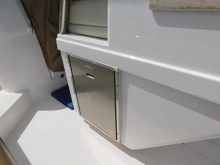 Happily Ever After Yacht Photos Pics 2016 Belzona 327 WA boat interior with stainless steel storage compartment.