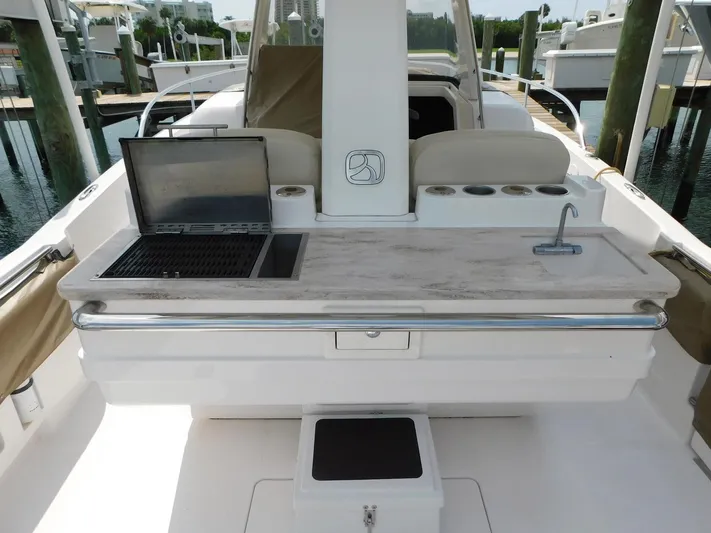 Happily Ever After Yacht Photos Pics 2016 Belzona 327 WA boat interior with grill and sink on deck.