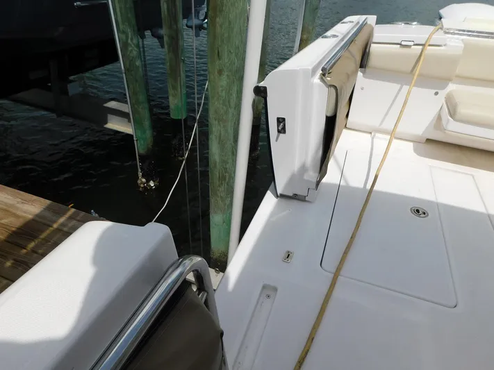 Happily Ever After Yacht Photos Pics 2016 Belzona 327 WA boat deck with open side door near dock.