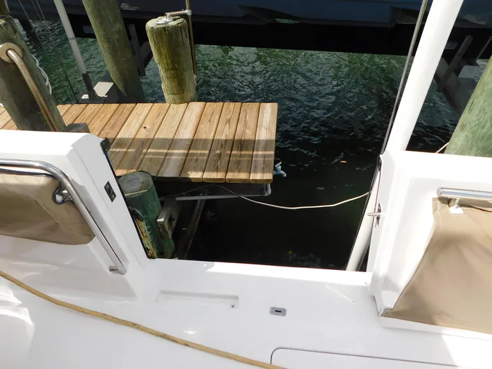 Happily Ever After Yacht Photos Pics Belzona 327 WA boat docked, showing deck and water view, 2016 model.