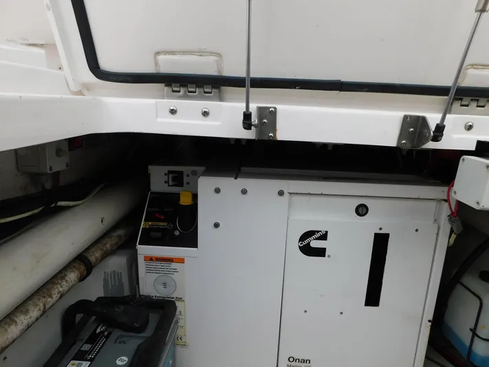 Happily Ever After Yacht Photos Pics Engine compartment of a 2016 Belzona 327 WA with Cummins Onan generator.