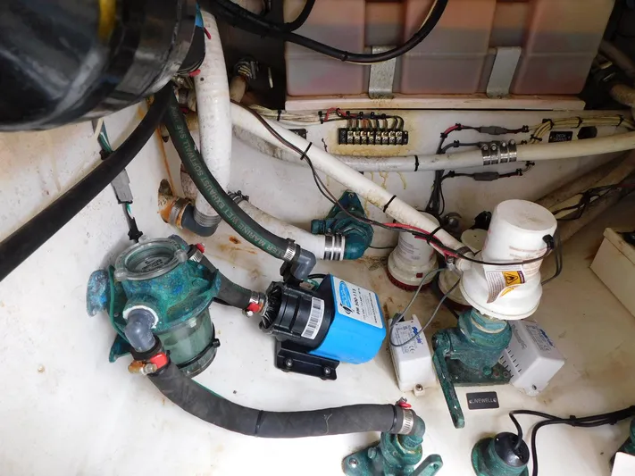 Happily Ever After Yacht Photos Pics Engine compartment of a 2016 Belzona 327 WA with various pumps and wiring.