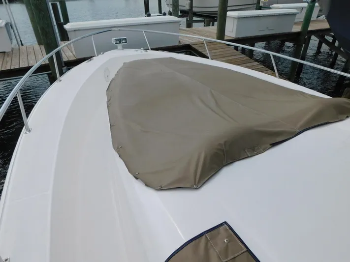 Happily Ever After Yacht Photos Pics 2016 Belzona 327 WA boat with a covered bow, docked at a marina.