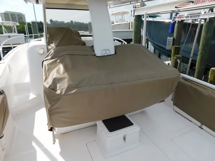 Happily Ever After Yacht Photos Pics 2016 Belzona 327 WA boat with covered seating area at dock.
