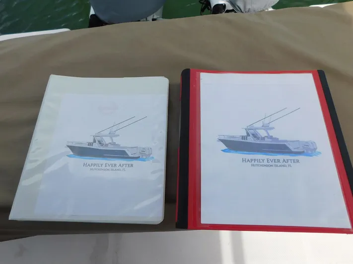Happily Ever After Yacht Photos Pics Binders with boat illustrations labeled "Happily Ever After," featuring a 2016 Belzona 327 WA.