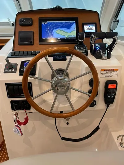 Silver Lining Yacht Photos Pics Helm of 2021 Back Cove 34 O with navigation display and controls.
