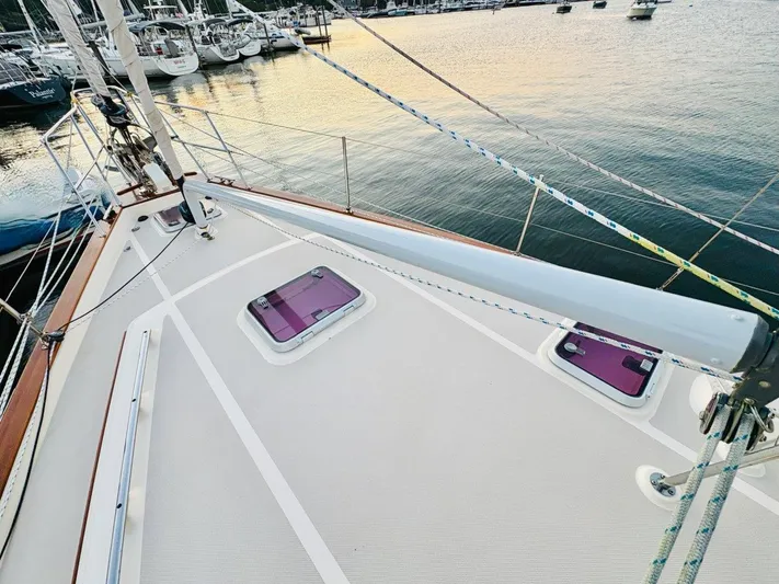 Calliope Yacht Photos Pics Deck view of 2007 Island Packet 485 sailboat at marina, showcasing rigging and hatches.