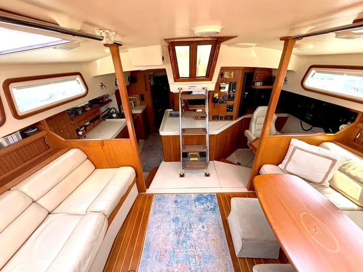 Calliope Yacht Photos Pics Luxurious interior of 2007 Island Packet 485 yacht with elegant wood finishes and comfortable seating.