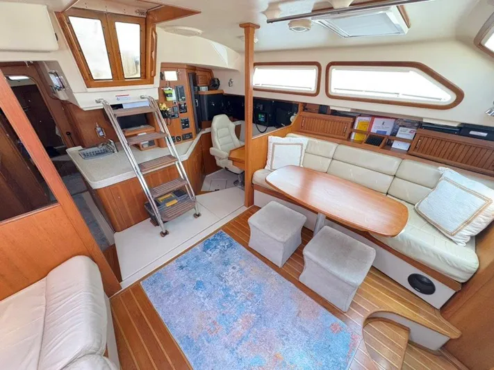Calliope Yacht Photos Pics Luxurious 2007 Island Packet 485 yacht interior with cozy seating and elegant wood finishes.