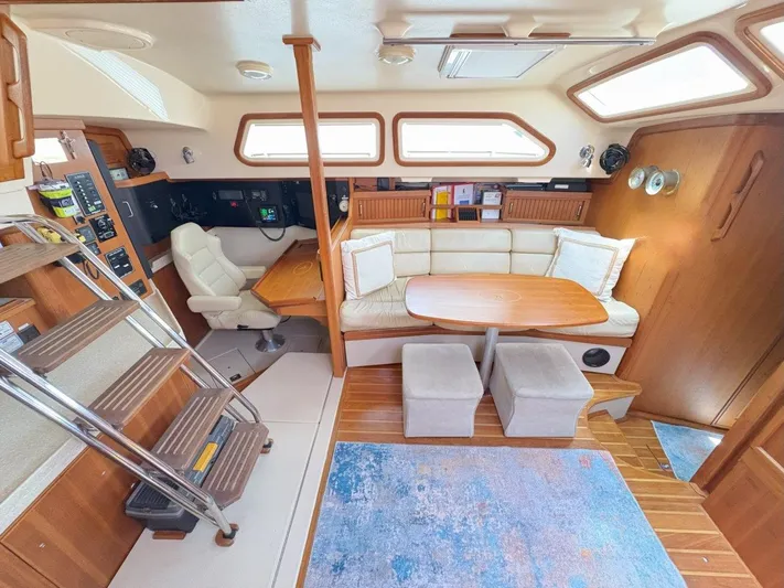 Calliope Yacht Photos Pics Interior of 2007 Island Packet 485 yacht with cozy seating and navigation area.