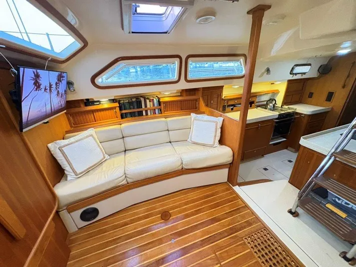 Calliope Yacht Photos Pics Luxurious interior of 2007 Island Packet 485 yacht with cozy seating and modern kitchen.