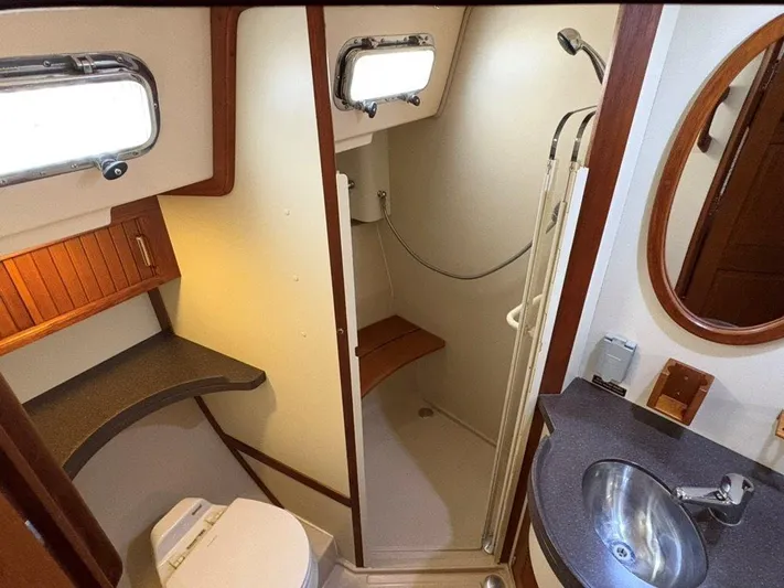 Calliope Yacht Photos Pics 2007 Island Packet 485 yacht bathroom with shower, sink, and toilet.