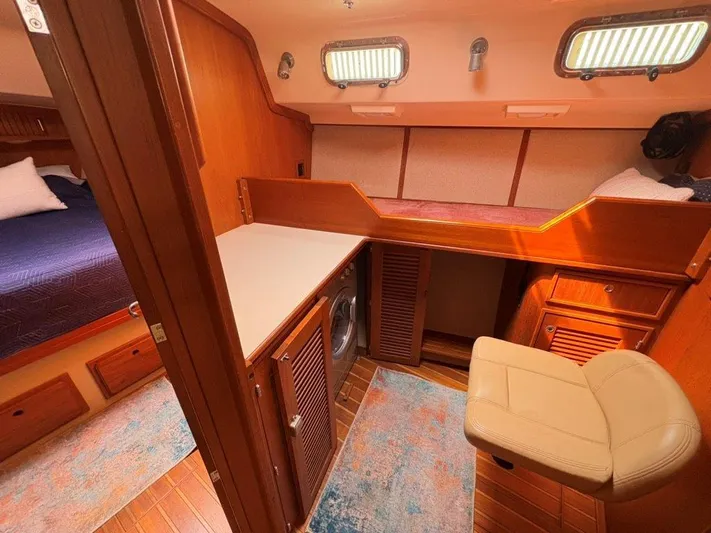 Calliope Yacht Photos Pics Interior of 2007 Island Packet 485 yacht with wood finish and cozy seating area.