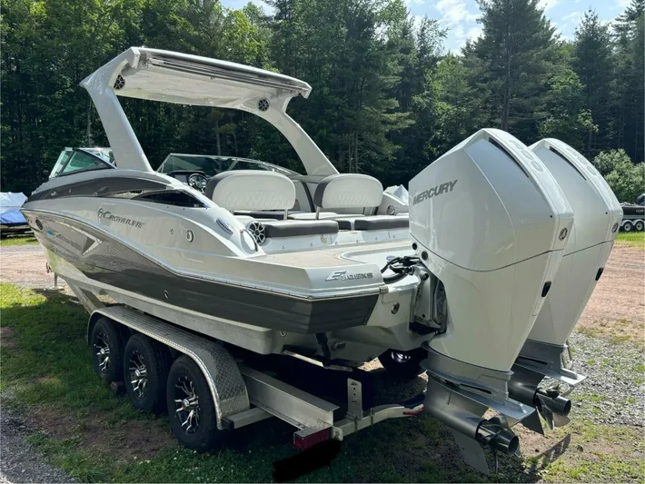  Yacht Photos Pics 2021 Crownline E305XS boat on trailer with dual Mercury engines, parked outdoors.