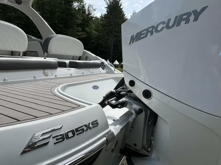  Yacht Photos Pics 2021 Crownline E305XS boat with Mercury engine, featuring sleek design and comfortable seating.