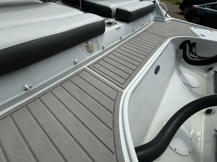  Yacht Photos Pics 2021 Crownline E305XS boat deck with cushioned seating and non-slip flooring.