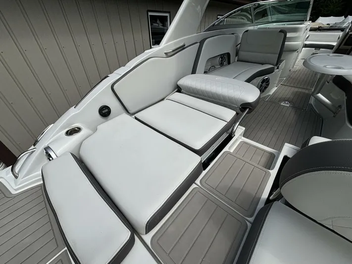  Yacht Photos Pics 2021 Crownline E305XS boat interior with luxurious seating and modern design.