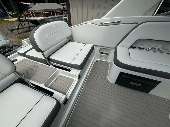  Yacht Photos Pics 2021 Crownline E305XS boat interior with gray seating and flooring.