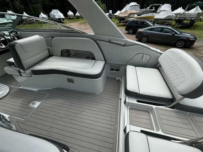 Yacht Photos Pics 2021 Crownline E305XS boat interior with sleek seating and modern design.