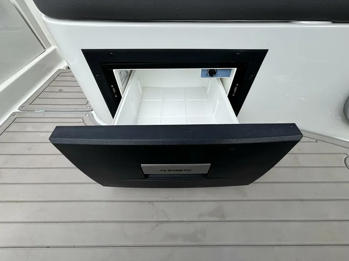  Yacht Photos Pics Open drawer on 2021 Crownline E305XS boat, featuring a Dometic cooler.