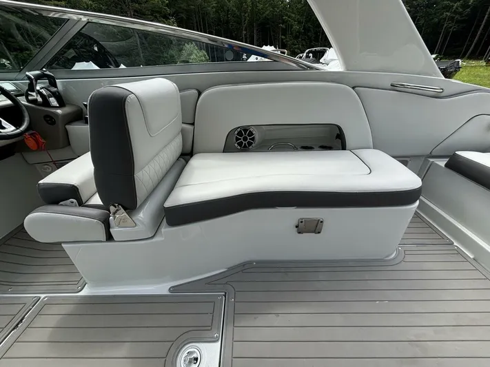  Yacht Photos Pics 2021 Crownline E305XS boat interior with gray seating and sleek design.