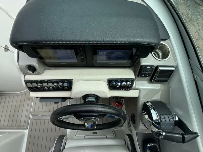  Yacht Photos Pics 2021 Crownline E305XS boat dashboard with dual screens and controls.