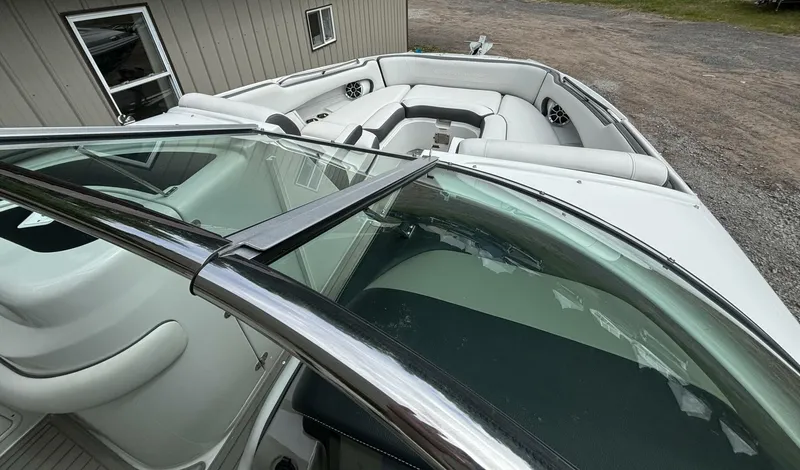  Yacht Photos Pics 2021 Crownline E305XS boat interior with white seating and windshield view.