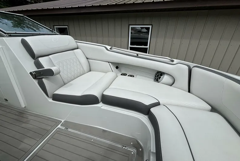  Yacht Photos Pics 2021 Crownline E305XS boat interior with luxurious white seating and modern design.