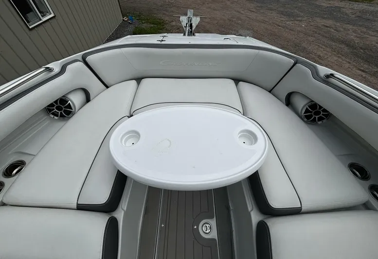 Yacht Photos Pics 2021 Crownline E305XS boat interior with white seating and round table.