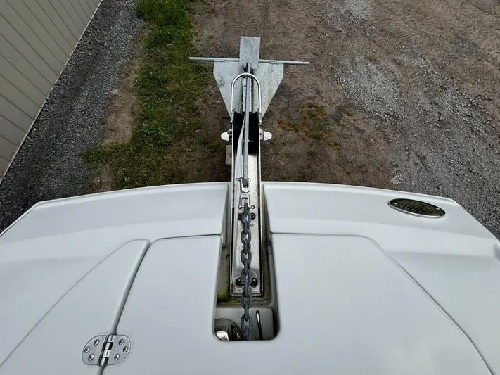  Yacht Photos Pics 2021 Crownline E305XS boat anchor and chain on deck, viewed from above.