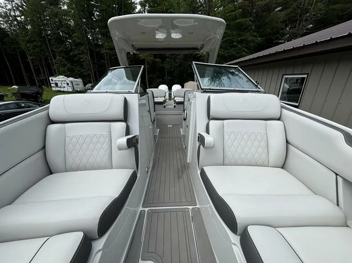  Yacht Photos Pics 2021 Crownline E305XS boat interior with luxurious seating and modern design.