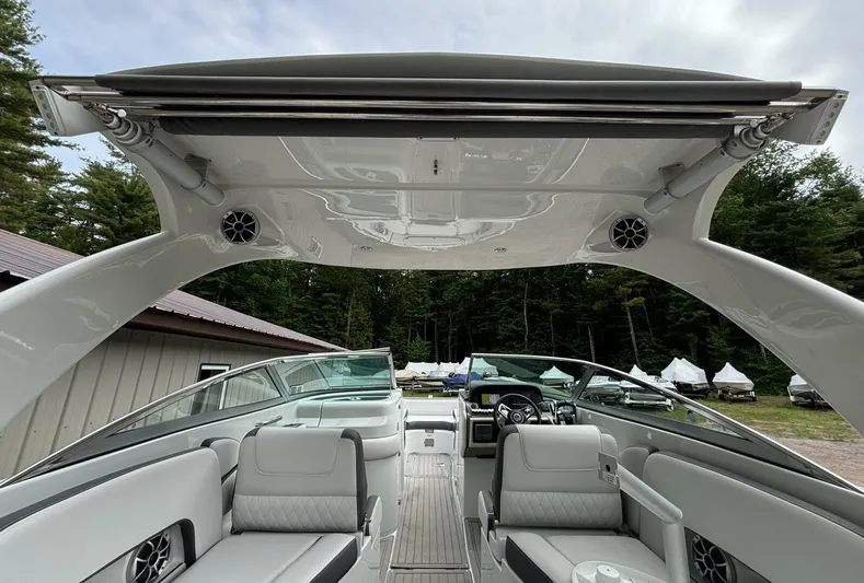  Yacht Photos Pics 2021 Crownline E305XS boat interior with sleek seating and modern design.