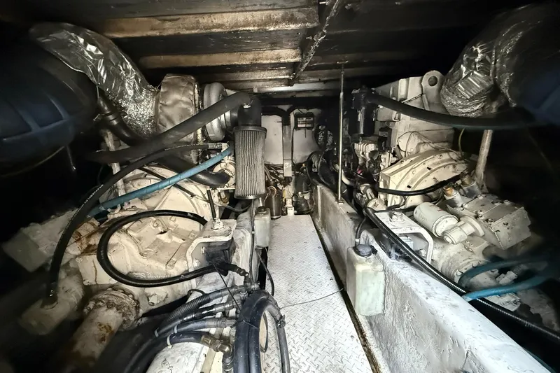  Yacht Photos Pics Engine room of a 2005 Sea Ray 500 Sedan Bridge yacht, showcasing dual engines and mechanical components.