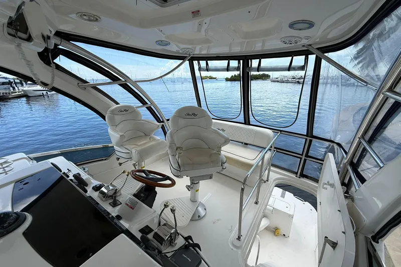  Yacht Photos Pics Interior view of 2005 Sea Ray 500 Sedan Bridge yacht with helm and seating.