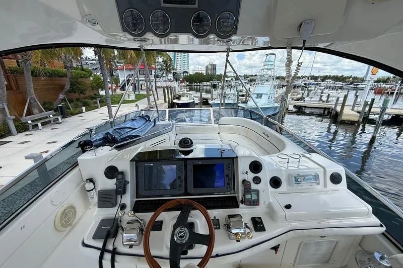  Yacht Photos Pics Cockpit view of 2005 Sea Ray 500 Sedan Bridge yacht at marina.