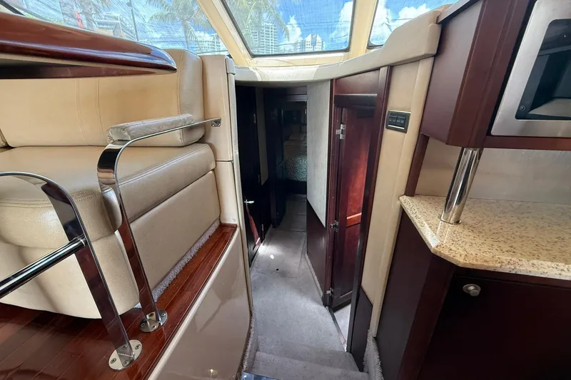  Yacht Photos Pics Interior of 2005 Sea Ray 500 Sedan Bridge yacht with luxurious seating and cabinetry.