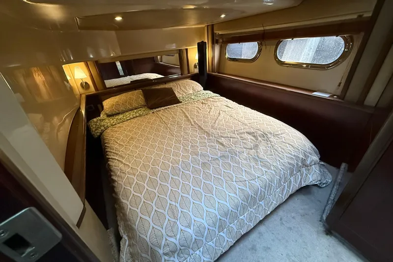  Yacht Photos Pics Luxurious bedroom interior of 2005 Sea Ray 500 Sedan Bridge yacht.