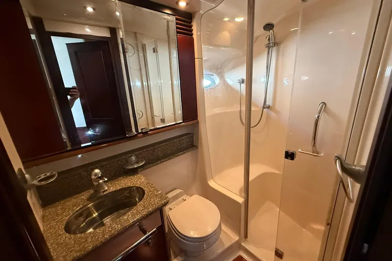  Yacht Photos Pics Luxurious bathroom in 2005 Sea Ray 500 Sedan Bridge yacht with shower and vanity.