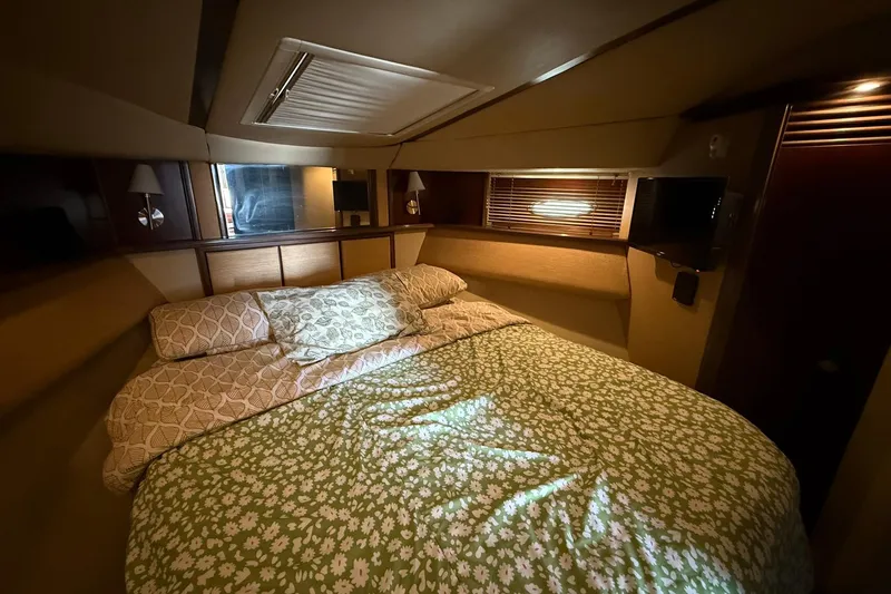  Yacht Photos Pics Luxurious bedroom interior of 2005 Sea Ray 500 Sedan Bridge yacht with cozy bedding.